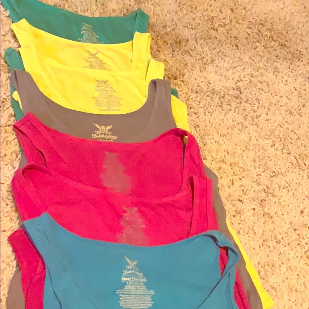 7 large faded glory tank tops.
